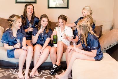 Bridal party drinking champagne